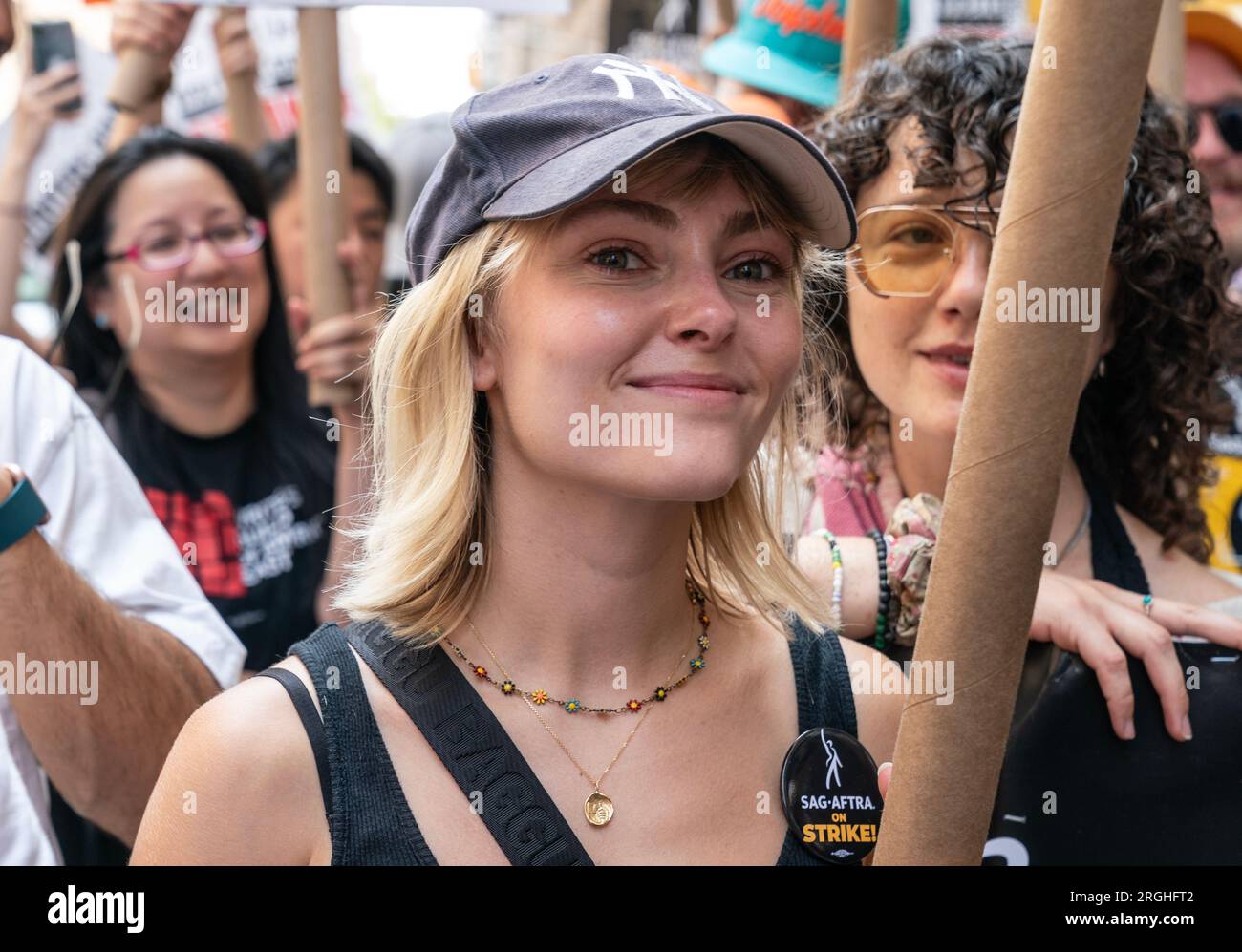 AnnaSophia Robb attends WGA picket on 100th day of strike at Netflix and Warner Bros. Discovery offices in New York on August 9, 2023 Stock Photo