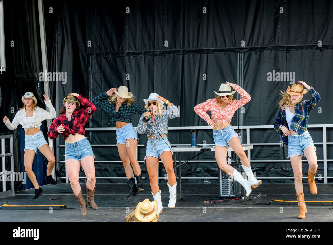Saint John, NB, Canada - July 29, 2023: Performers teach Country Line Dancing at the Waterfront Container Village during a free, non-ticket event. Stock Photo