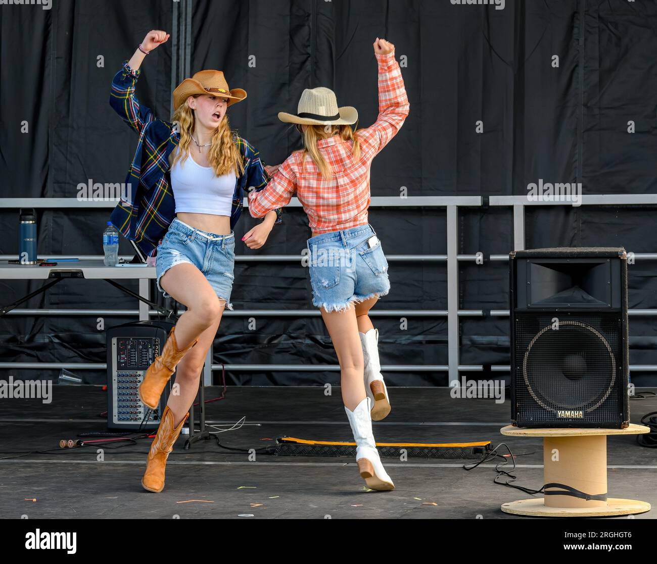 Saint John, NB, Canada - July 29, 2023: Performers teach Country Line Dancing at the Waterfront Container Village during a free, non-ticket event. Stock Photo