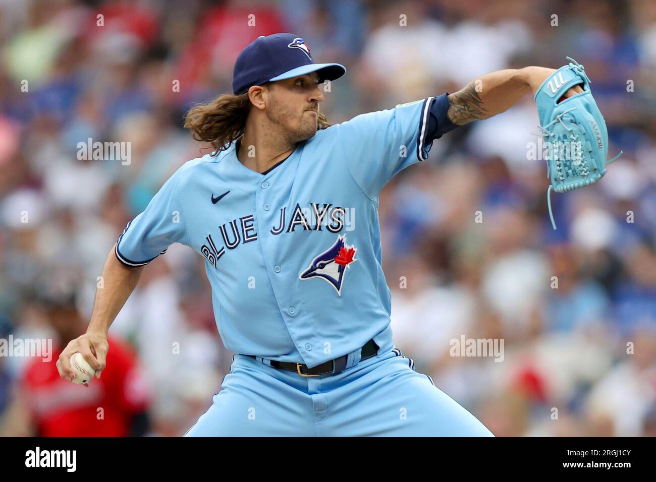 CLEVELAND, OH - MAY 7: Toronto Blue Jays starting pitcher Kevin Gausman  (34) looks on while sitting in the dugout during a game against the  Cleveland Guardians at Progressive Field on May