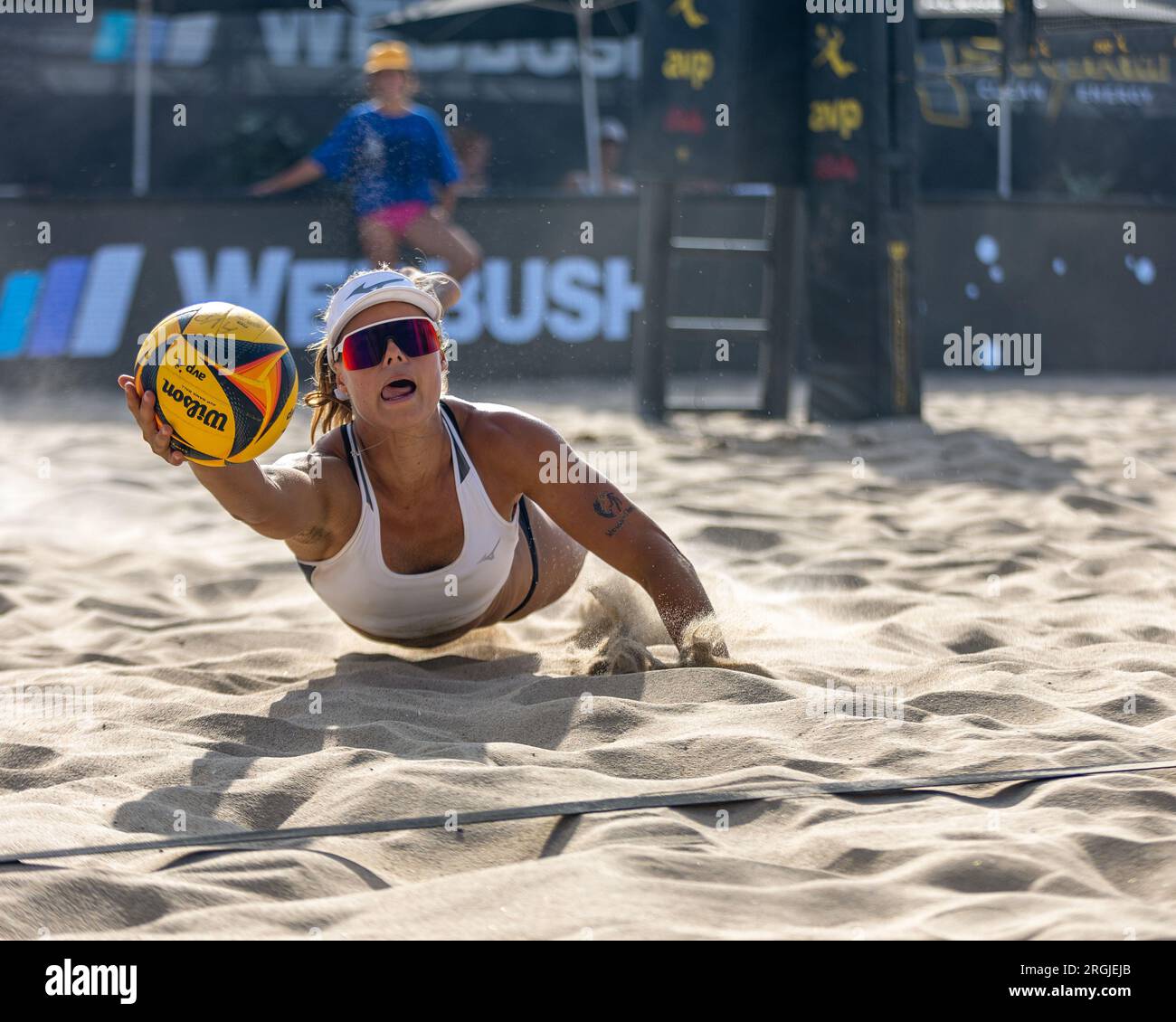 Hailey Harward dives to dig the ball at the AVP Hermosa Beach Open on July 7th, 2023. (John