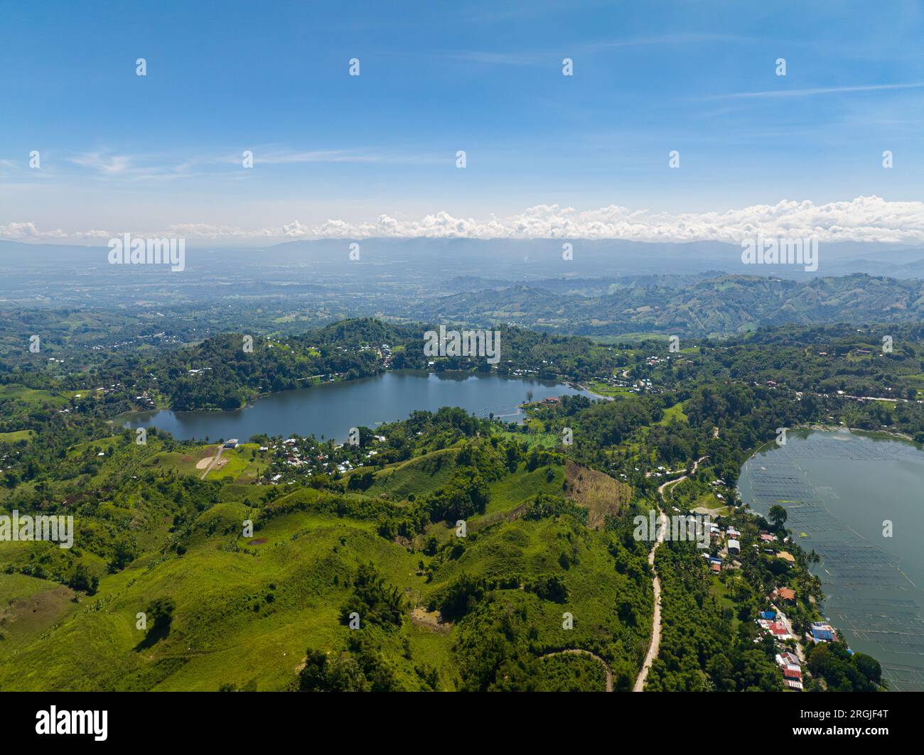 Mountain with rainforest sorrounded in Lake Lahit. Lake Sebu, South Cotabato. Mindanao, Philippines. Stock Photo