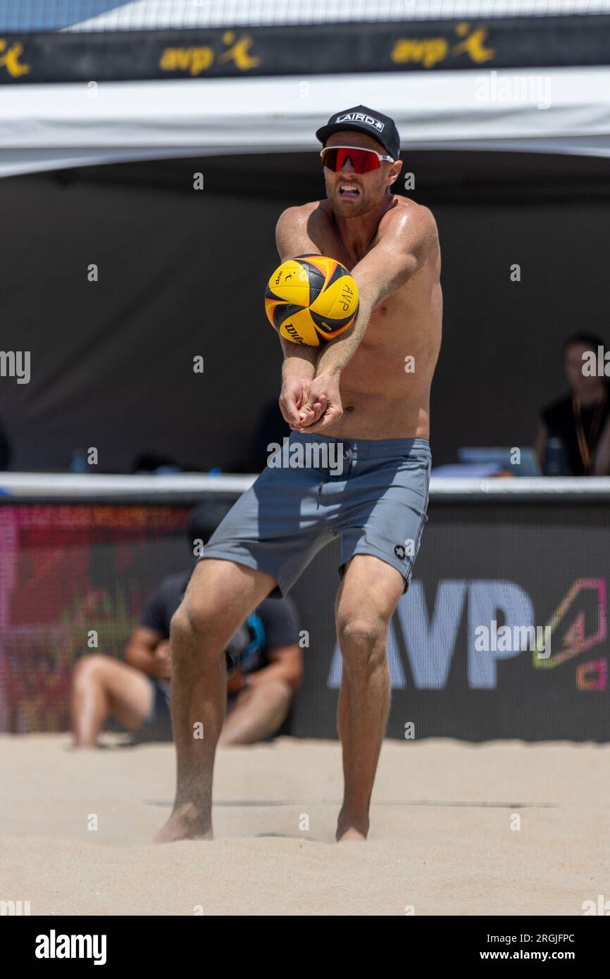 Chaim Schalk passes the ball during the AVP Hermosa Beach Open on 8 July 2023. (John Geldermann/Alamy) Stock Photo
