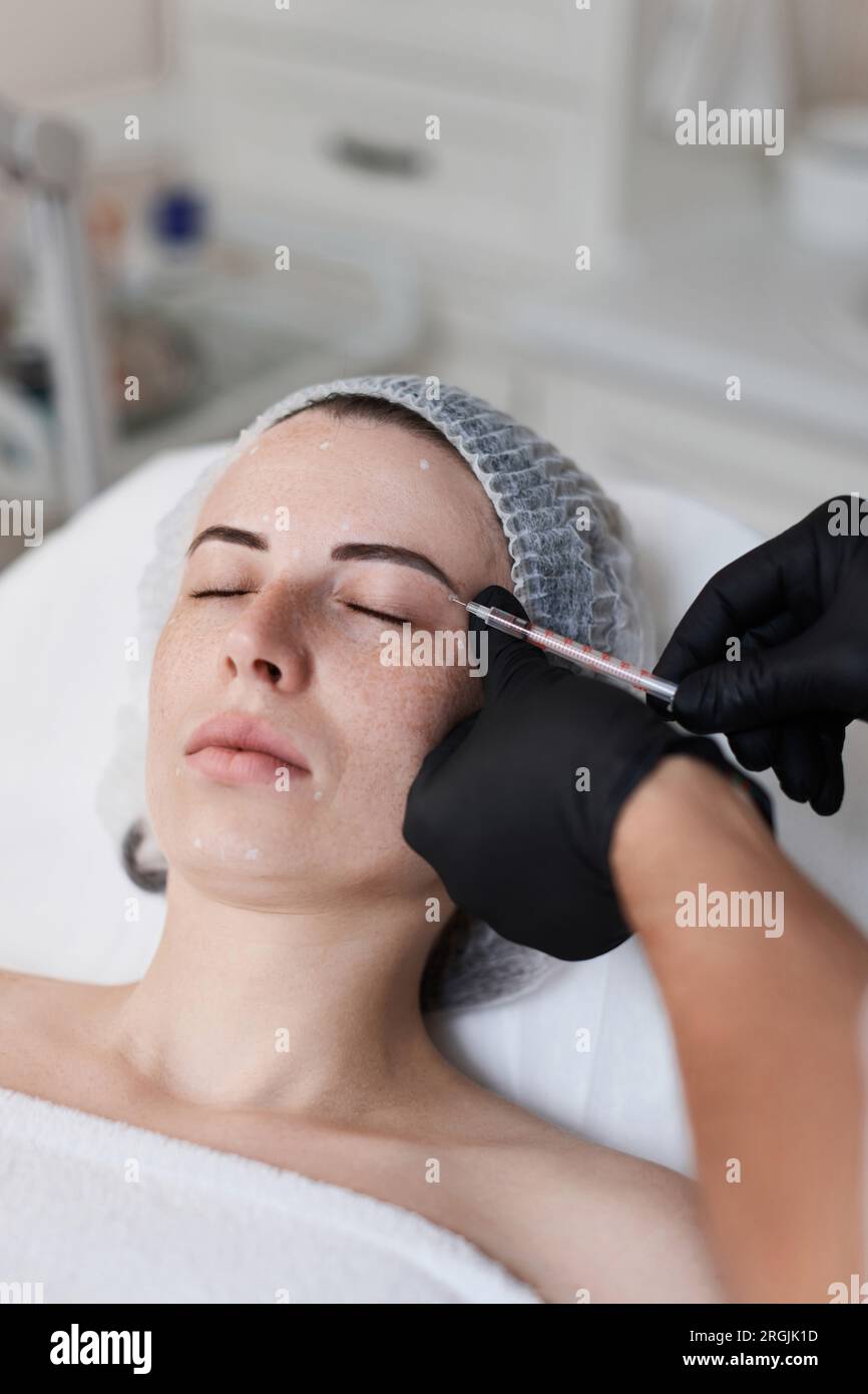 woman receives cosmetic botox injection in face Stock Photo - Alamy