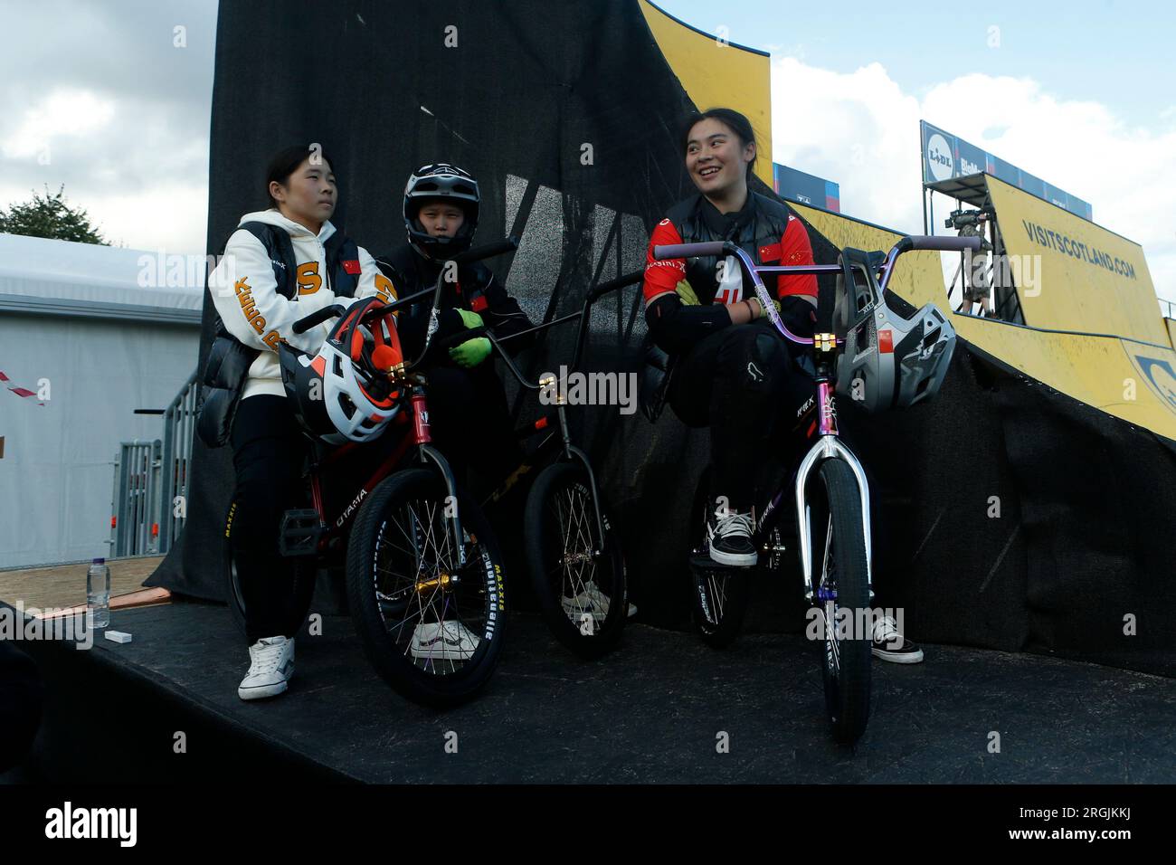 China's Sibei Sun (left), China's Huimin Zhou (centre) and China's Yawen Deng group together in the BMX Freestyle Park Women’s Elite Final during day five of the 2023 UCI Cycling World Championships at the Glasgow Green, Glasgow. Picture date: Monday August 7, 2023. Stock Photo