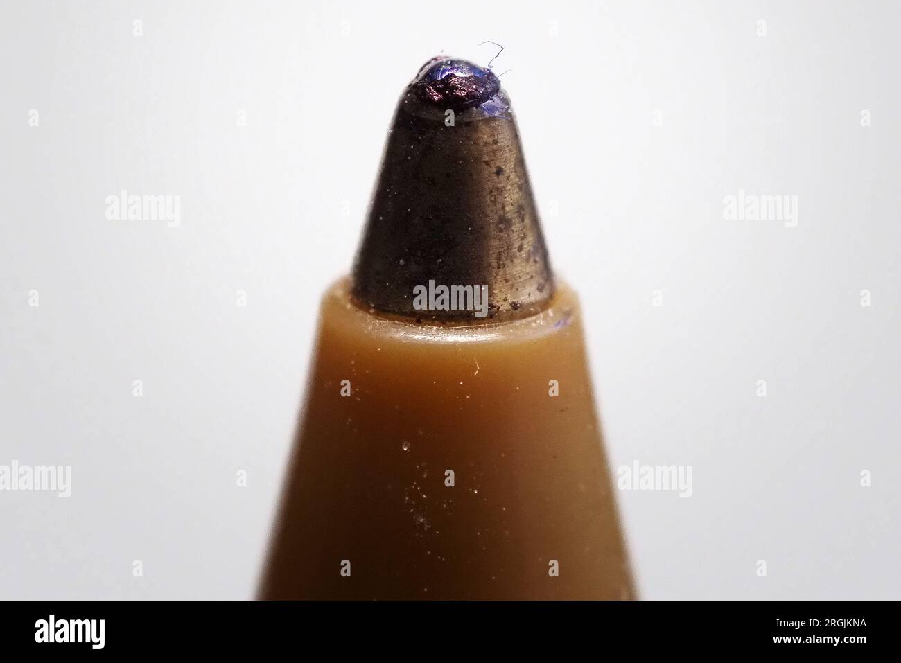 Ink ball macro view of a ballpoint pen. The ballpoint pen takes its