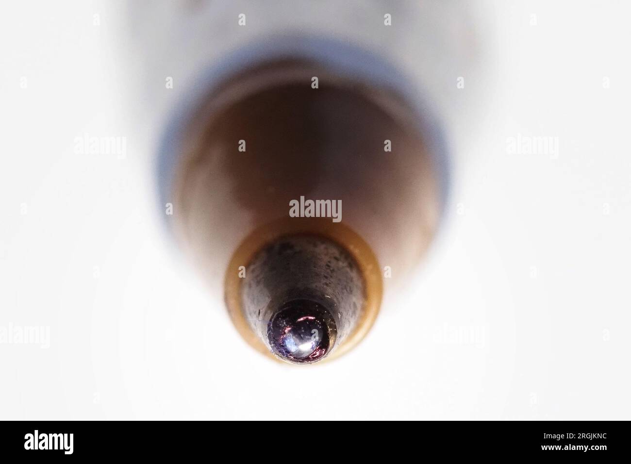 Ink ball macro view of a ballpoint pen. The ballpoint pen takes its