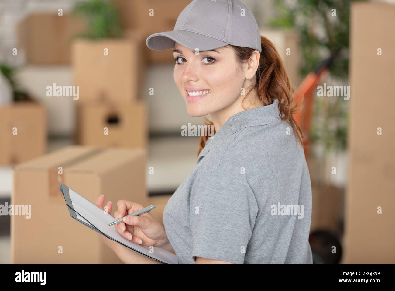 Delivery woman in uniform hi-res stock photography and images - Alamy