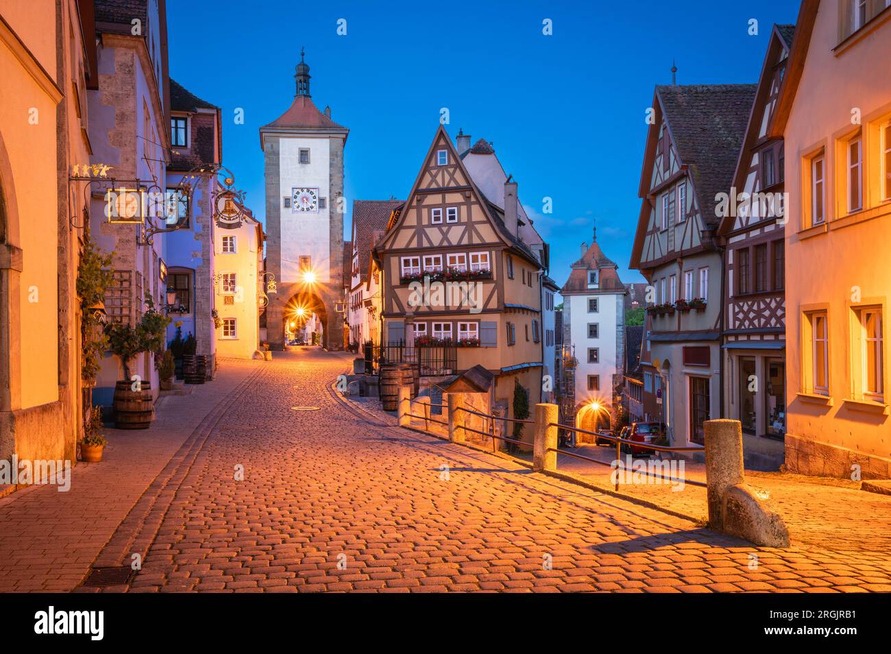 Dusk's Charm - Strolling Through the Beauty of a Medieval Old Town of Rothenburg ob der Tauber, Germany Stock Photo