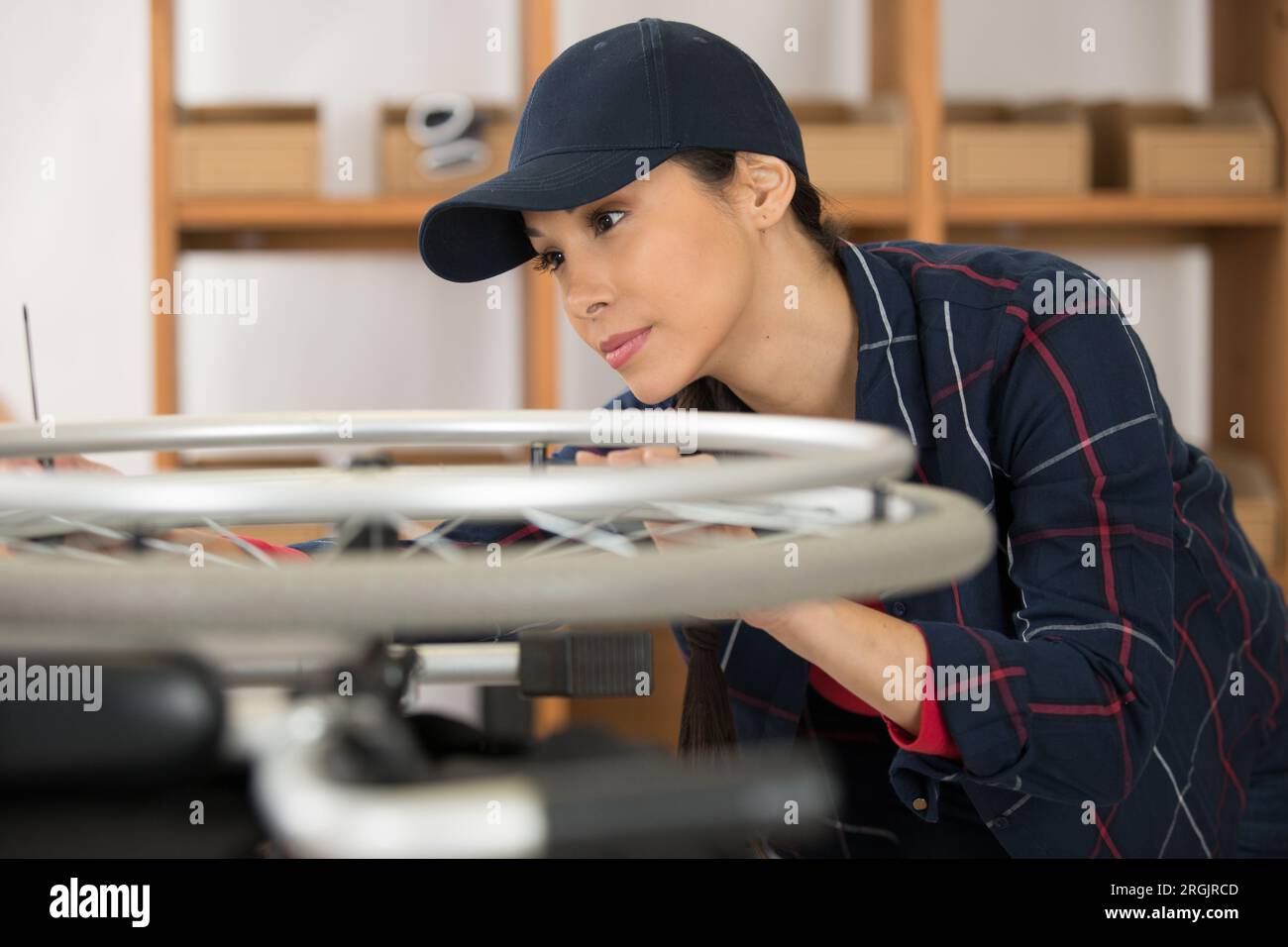 woman is fixing a wheelchair Stock Photo - Alamy