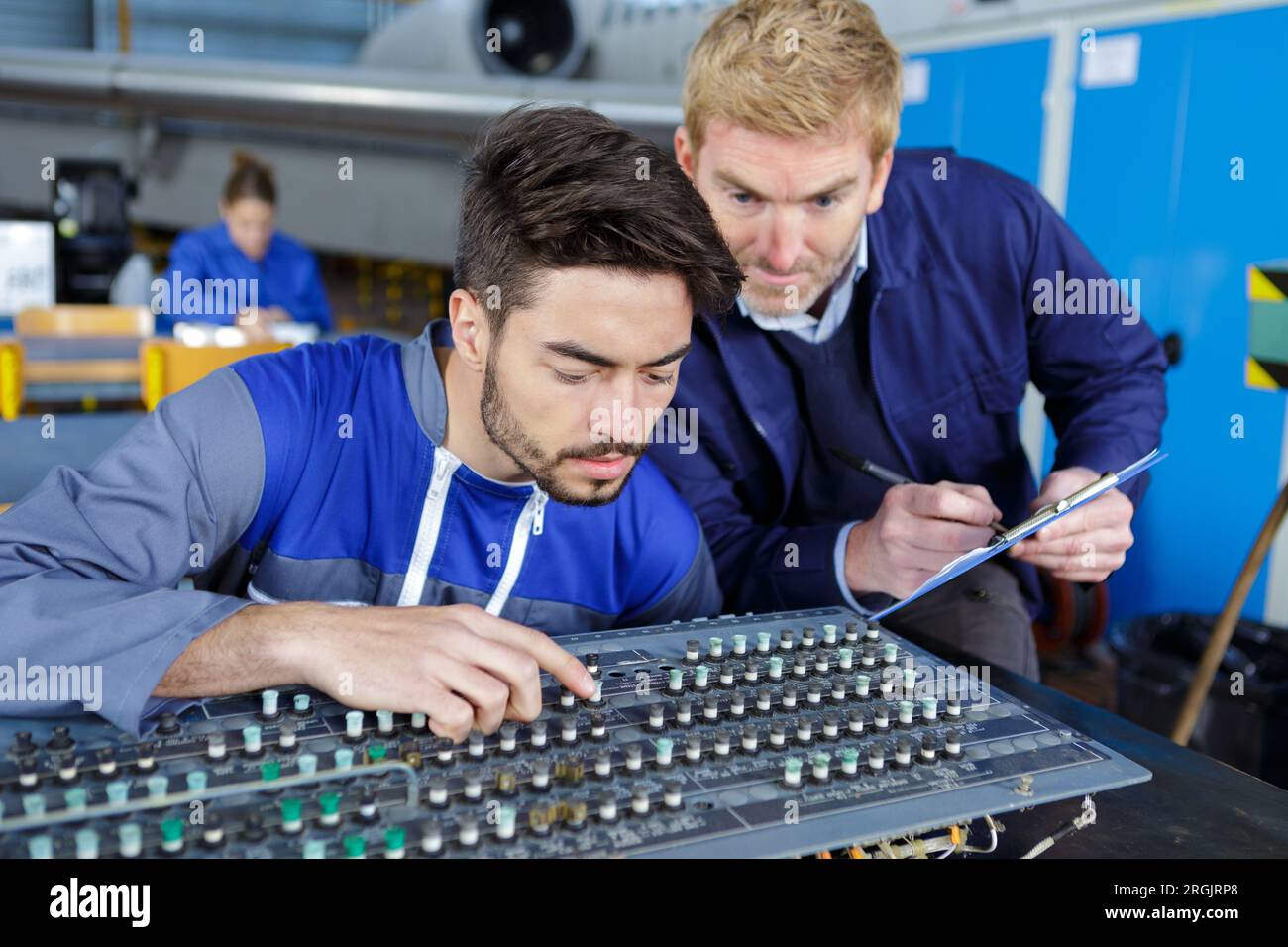 aviation technician working on instrument panel Stock Photo - Alamy