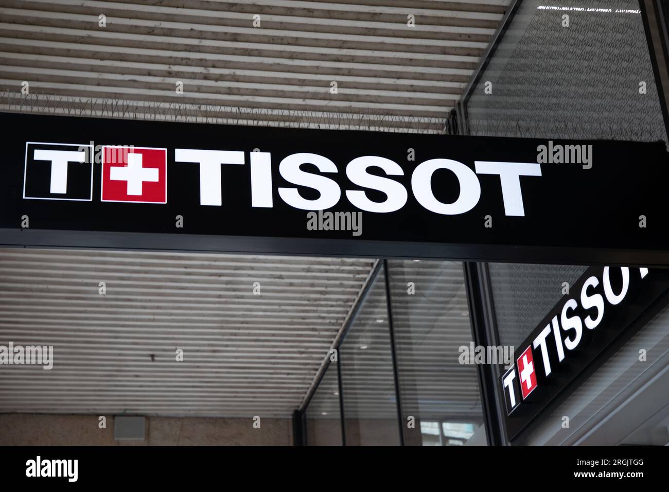 Milan , Italy  - 08 07 2023 : Tissot Watch Shop sign brand and text logo Swiss store facade manufacturer of luxury watches from Switzerland Stock Photo