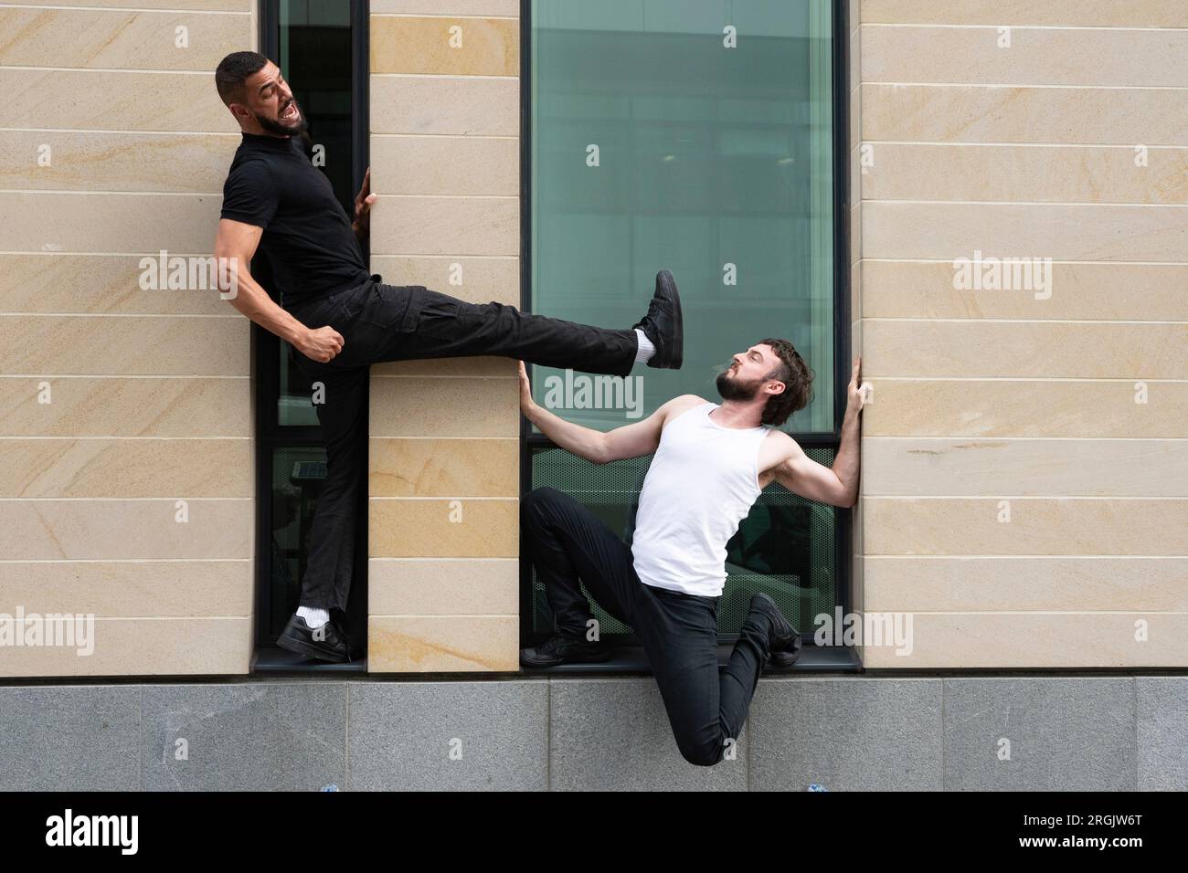 Edinburgh, Scotland, UK. 10th August 2023.  Performers David Banks and Sadiq Ali act out stuntman scenes from the movies. Their show Stuntman looks at the impact of action-hero role models on men and boys by taking inspiration from movies such as Die Hard and John Wick. The show is running at Summerhall.  Iain Masterton/Alamy Live News Stock Photo