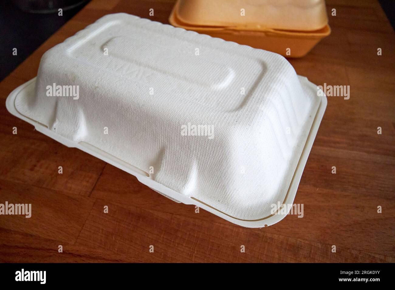 new biodegradable and old polystyrene food packaging uk Stock Photo