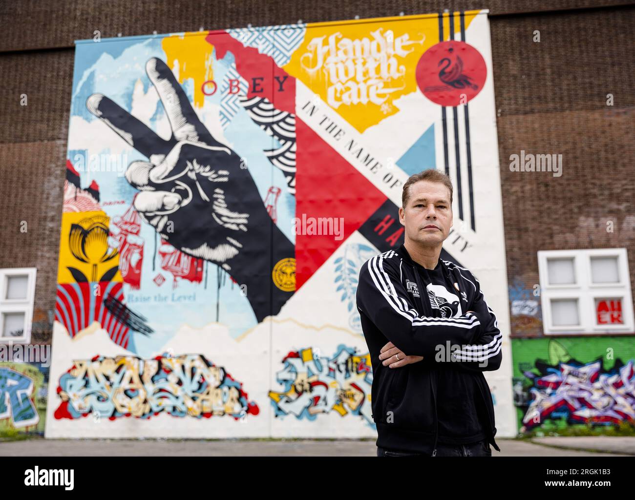 AMSTERDAM - Street artist Shepard Fairey during the unveiling of his new  mural on the side wall of the STRAAT Museum. The American artist is best  known for his famous HOPE poster, image size:1300x1024