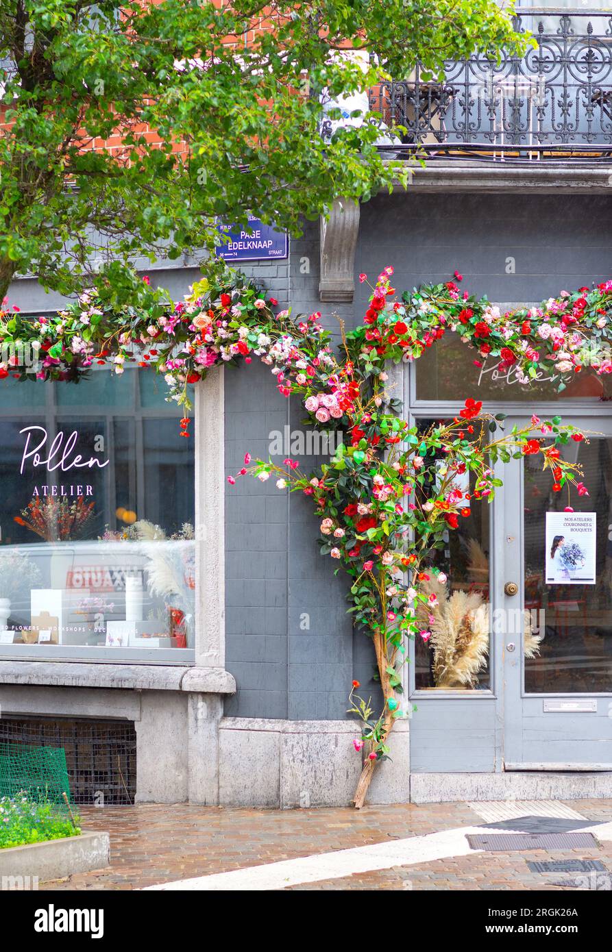Artificial flowers decorating front entrance of 'Pollen Atelier' in Ixelles, Brussels, Belgium. Stock Photo