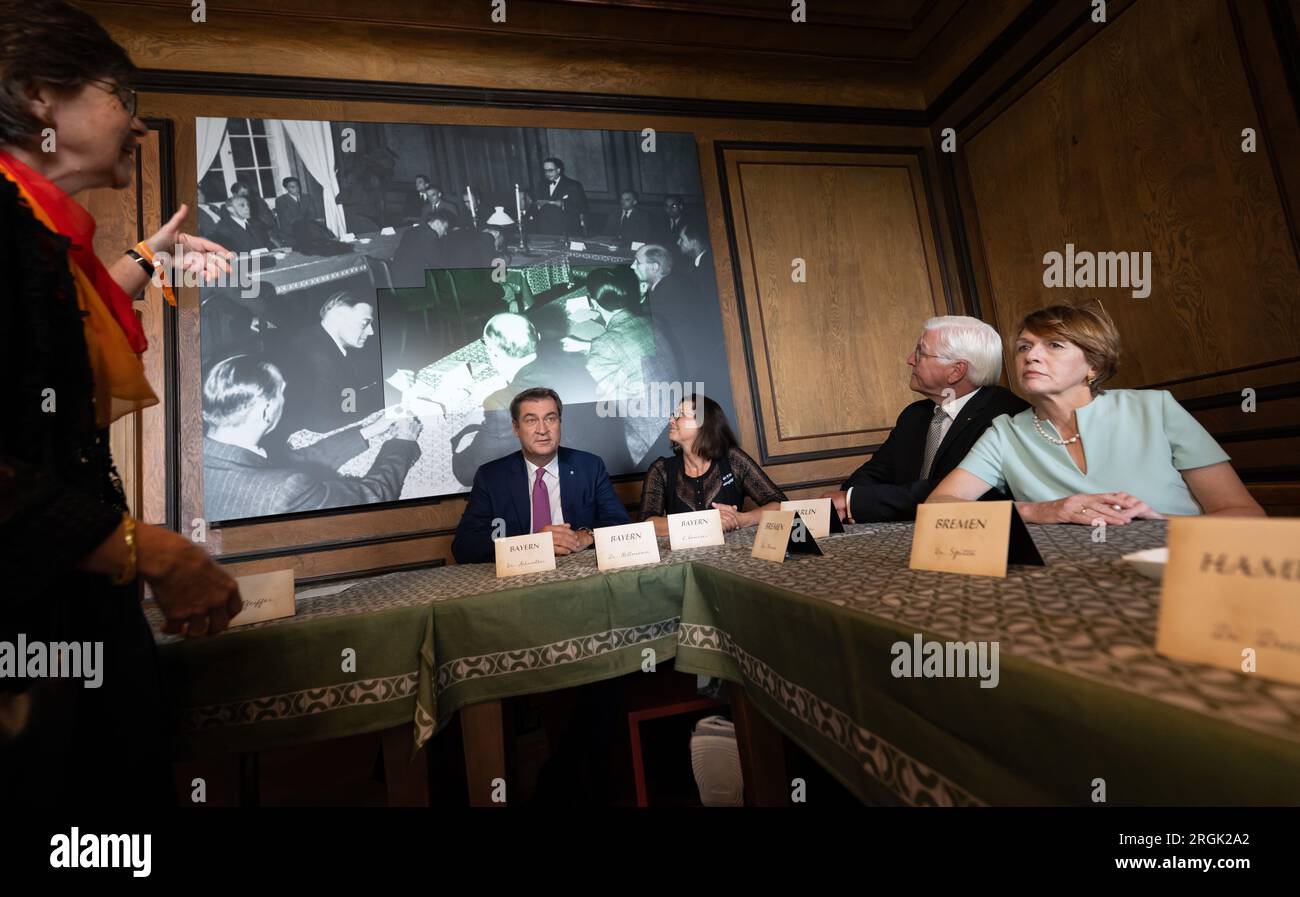 Herrenchiemsee, Germany. 10th Aug, 2023. Markus Söder (l-r, CSU), Prime Minister of Bavaria, Ilse Aigner, President of the Bavarian Parliament, Federal President Frank-Walter Steinmeier and his wife Elke Büdenbender have the exhibition in the New Palace explained to them by curator Uta Piereth (l) on the occasion of the 75th anniversary of the Herrenchiemsee Constitutional Convention. Credit: Peter Kneffel/dpa/Alamy Live News Stock Photo