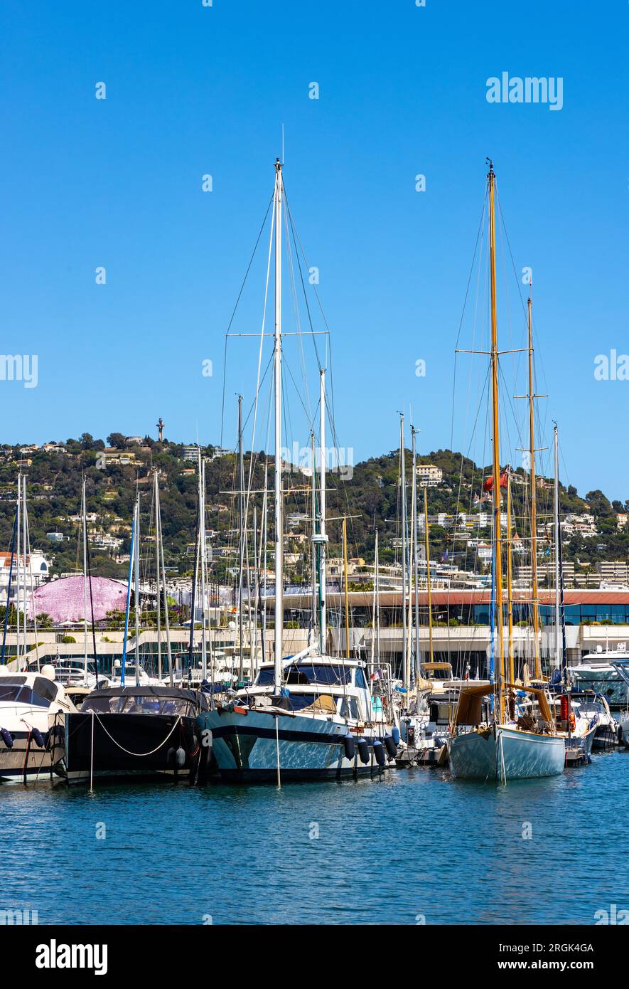 Cannes, France - July 31, 2022: Cannes center seafront panorama with historic old town Centre Ville quarter and yacht port onshore Mediterranean Sea Stock Photo