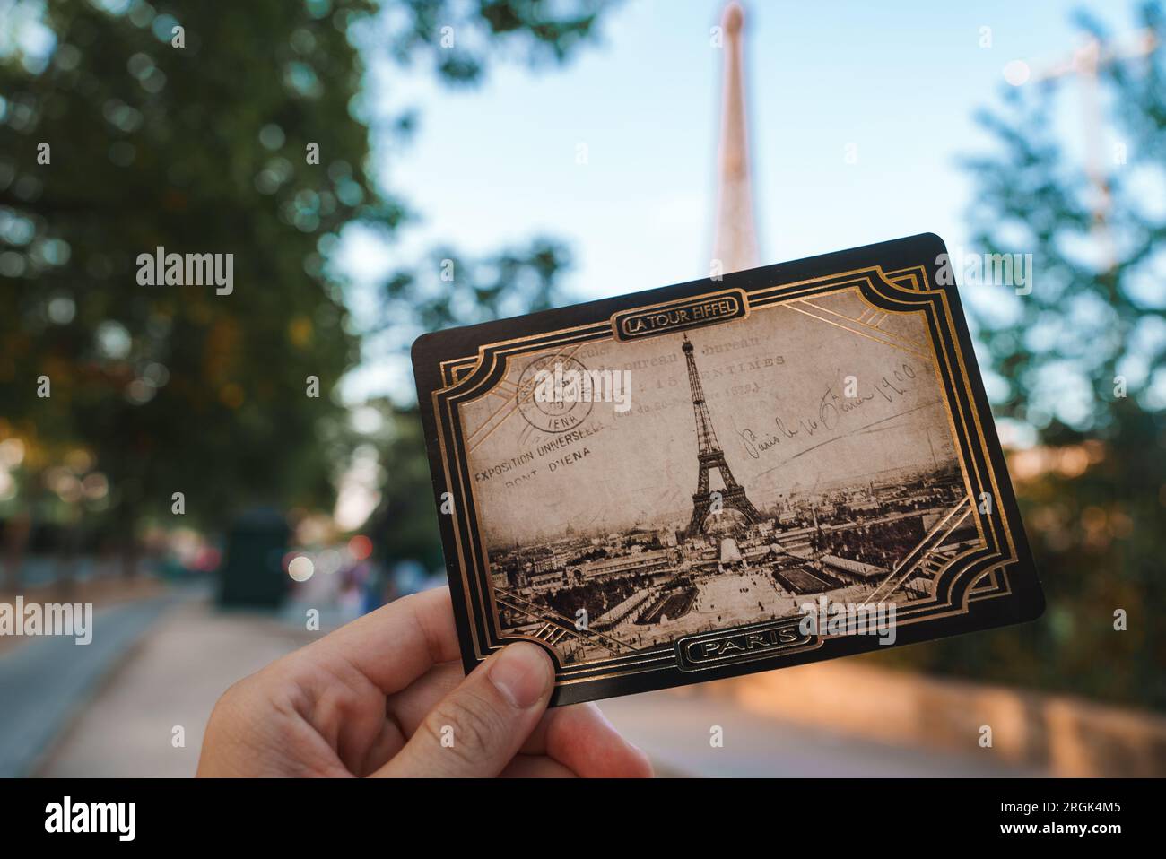 Joyful Person Holding Eiffel Tower Postcard Stock Photo