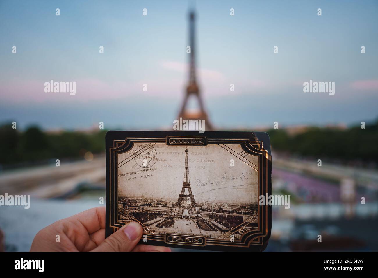 Holding Eiffel Tower Photo in Paris Stock Photo