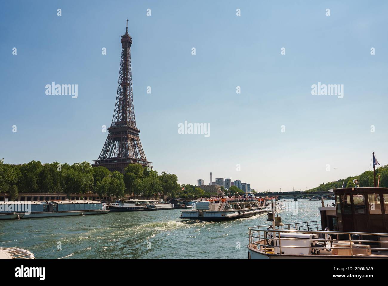 Sunny Eiffel Tower and Seine River Scene Stock Photo