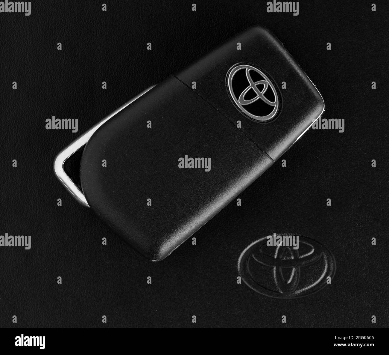 Istanbul, Turkey - March 18, 2023: Toyota car key with Toyota Owners Manual Guide Book. Toyota Corolla key. Stock Photo