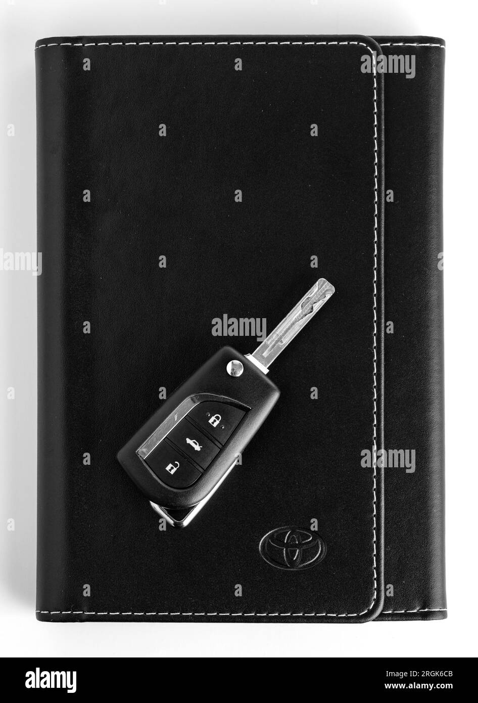 Istanbul, Turkey - March 18, 2023: Toyota car key with Toyota Owners Manual Guide Book. Toyota Corolla key. Stock Photo
