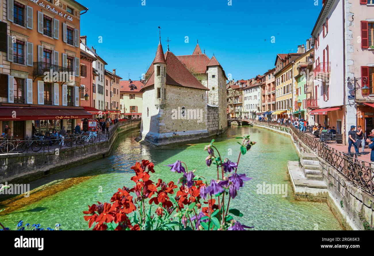 A landscape around Le Palais de I'Île. It is a medieval castle and prison in the middle of the Thiou Canal in Annecy, France. Stock Photo