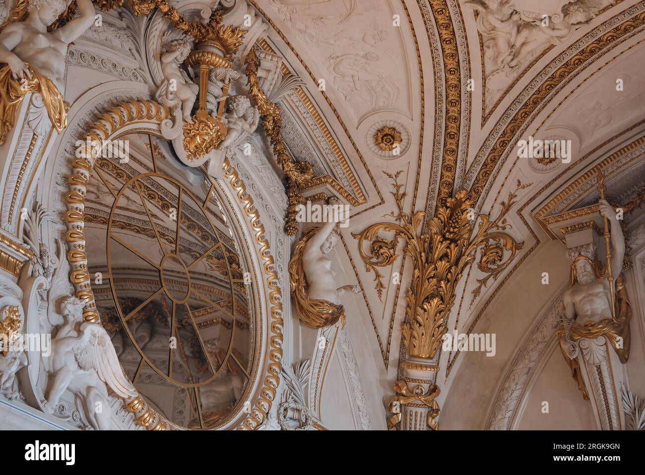 Ornate Rococo Ceiling with Round Mirror Stock Photo