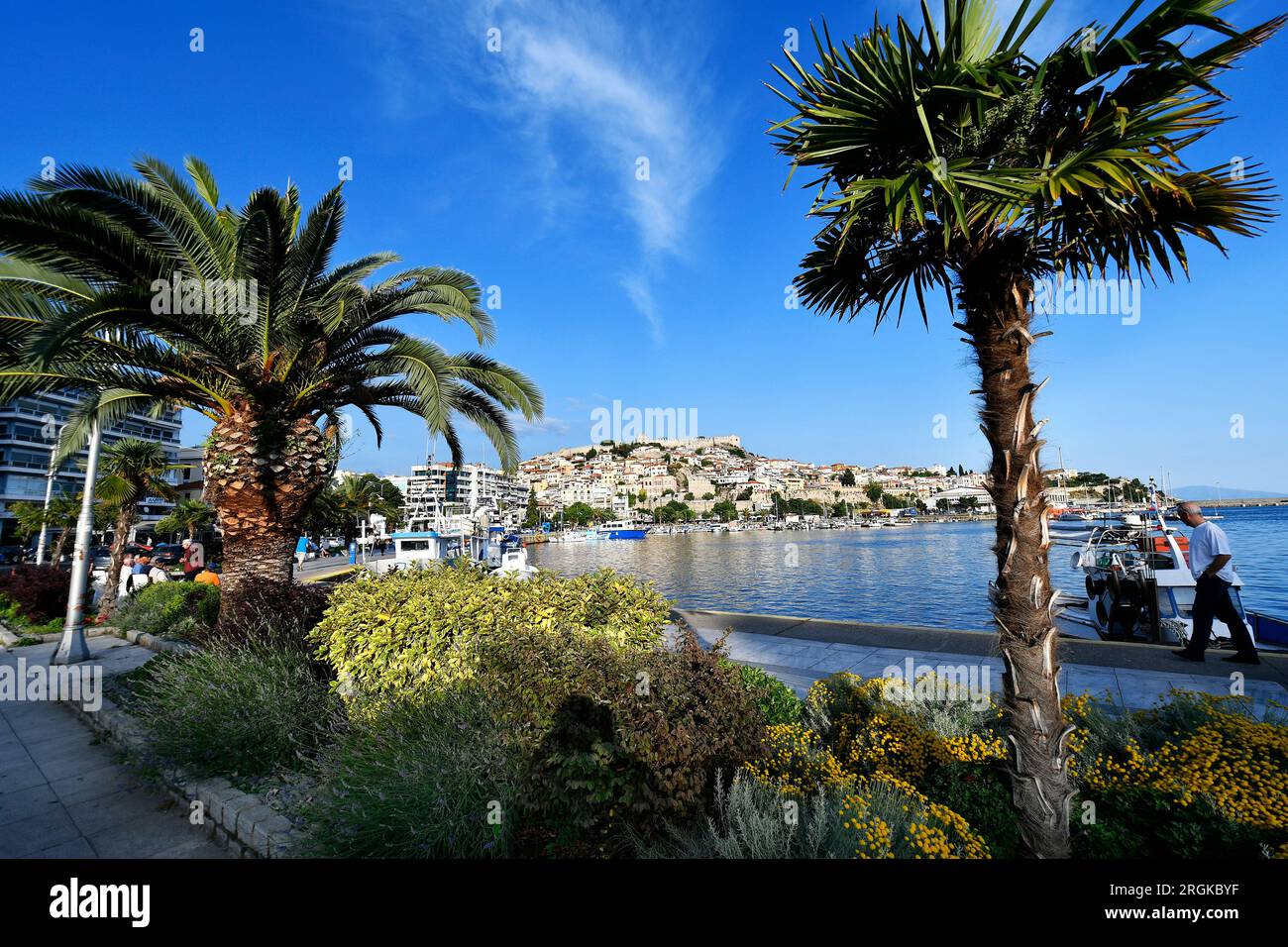 Kavala, Greece - June 13, 2023: Panoramic view of the city on the Aegean Sea with colorful houses, port, city walls and castle Stock Photo