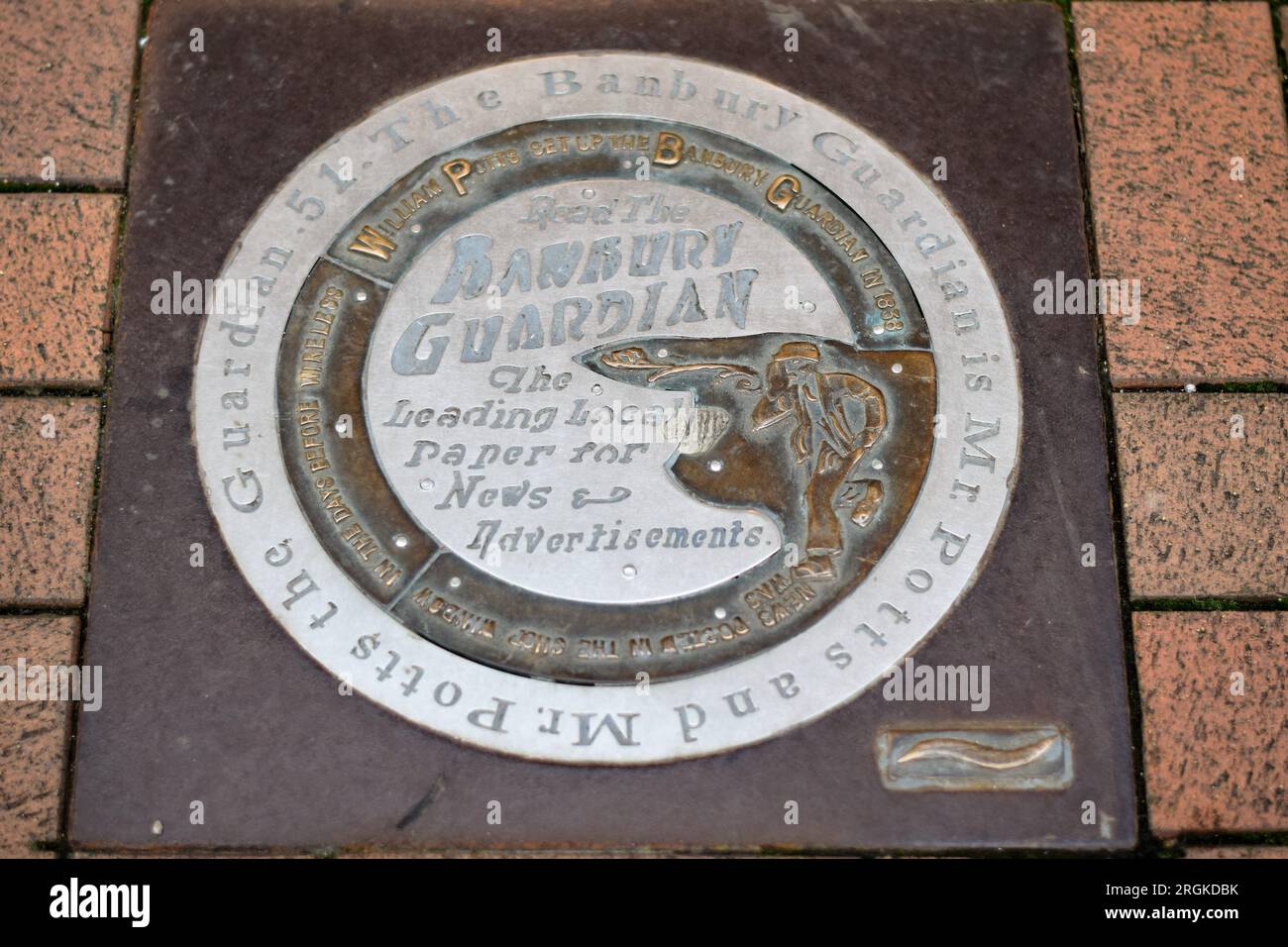 Bronze and steel marker at 16 Parson's Street in Banbury - marking the historical location of the Banbury Guardian printing works. Stock Photo