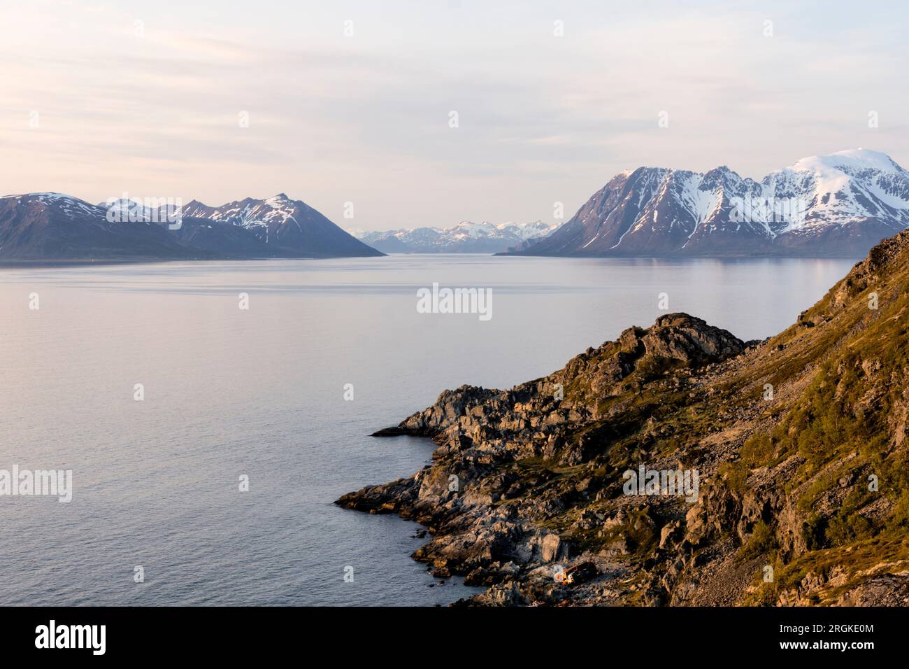 Hike in the midnight sun to Lyngstuva, the outermost point of the Lyngen Peninsula. View of the sea and islands. Lyngen Alps, Northern Norway Stock Photo