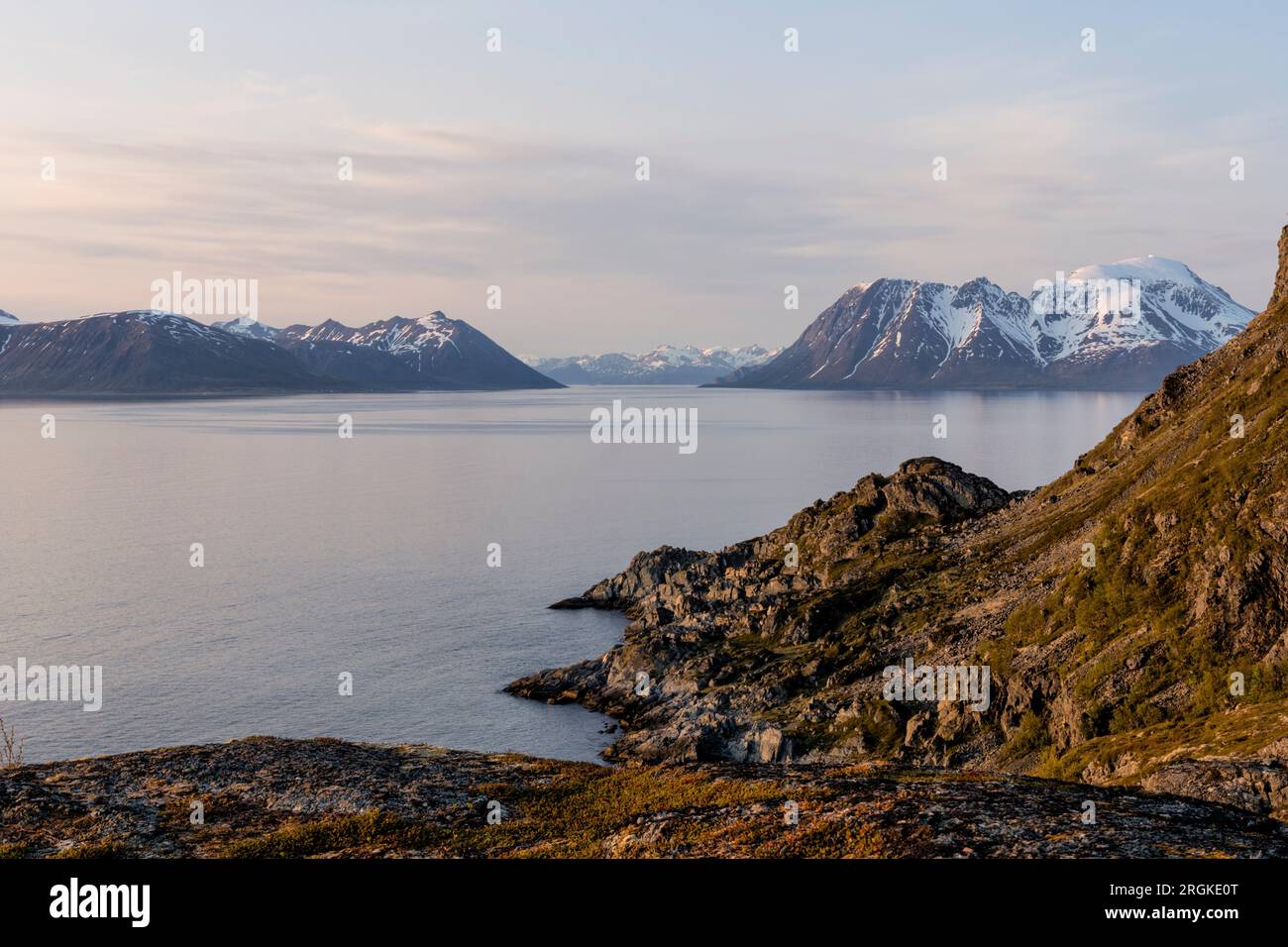 Hike in the midnight sun to Lyngstuva, the outermost point of the Lyngen Peninsula. View of the sea and islands. Lyngen Alps, Northern Norway, Europe Stock Photo
