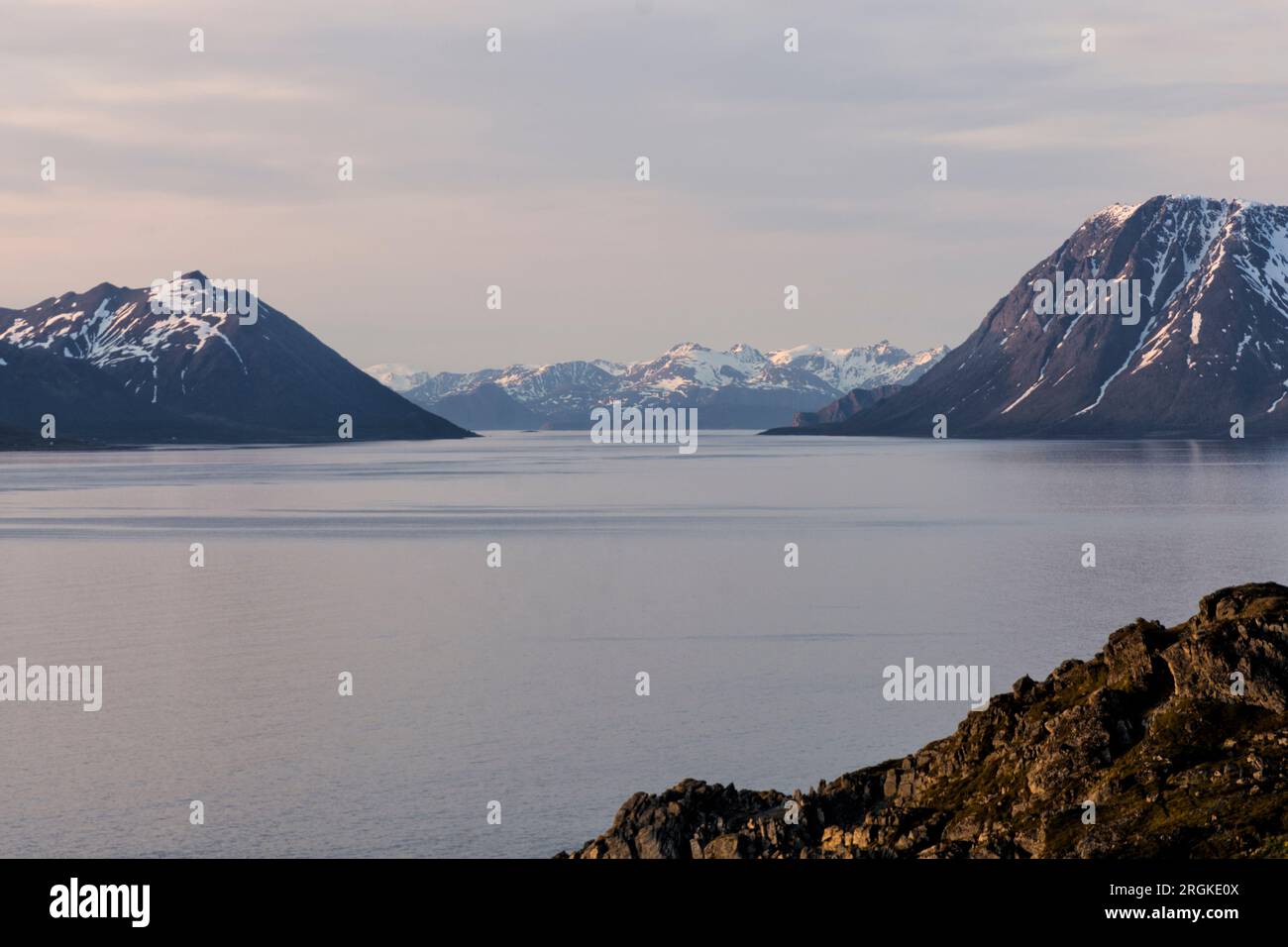 Hike in the midnight sun to Lyngstuva, the outermost point of the Lyngen Peninsula. View of the sea and islands. Lyngen Alps, Northern Norway, Europe Stock Photo