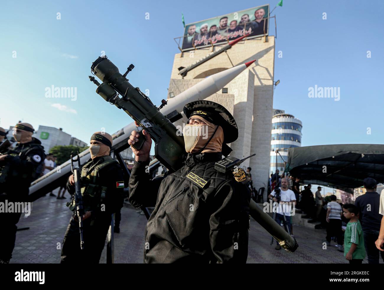 Members of the al-Quds Brigades, the military wing of Islamic Jihad, march during a military parade to commemorate their fighters who were killed last year during fighting between Israel and Islamic Jihad in Rafah, in the southern Gaza Strip. Stock Photo