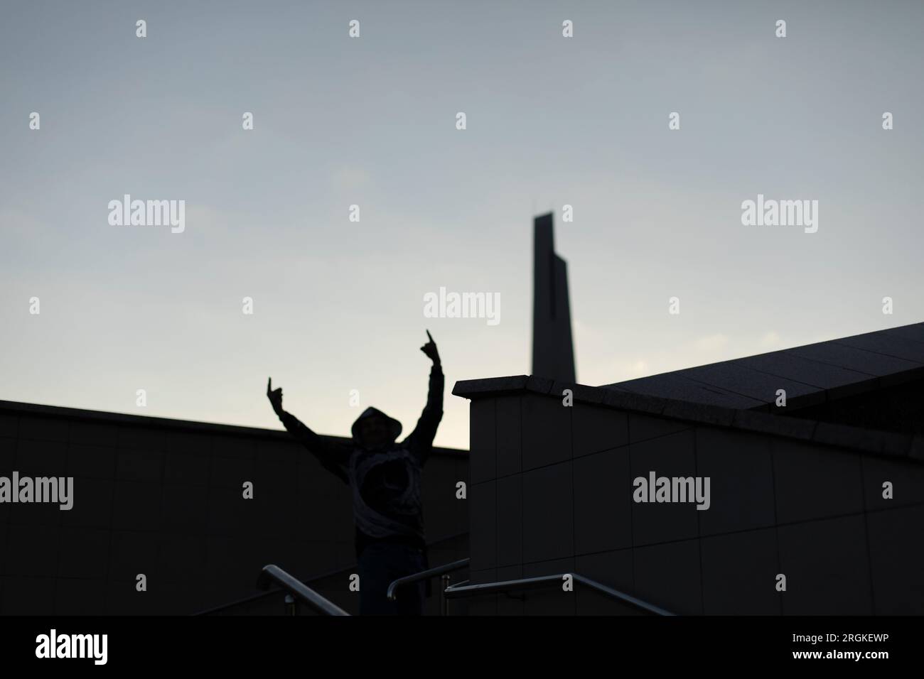 Silhouette man raised hands in hi-res stock photography and images - Alamy
