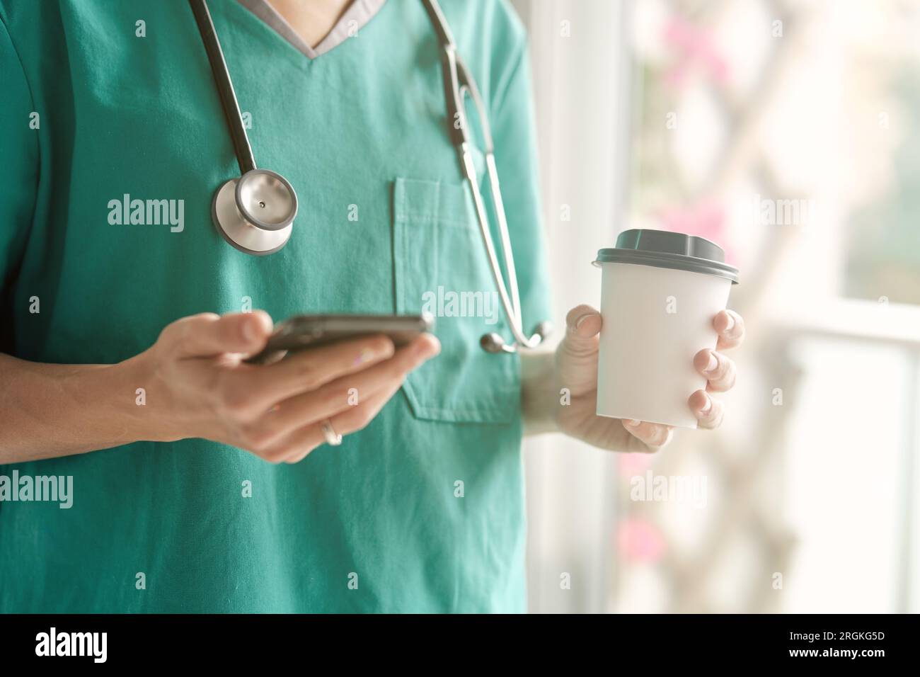Crop unrecognizable female doctor in medical uniform with stethoscope ...