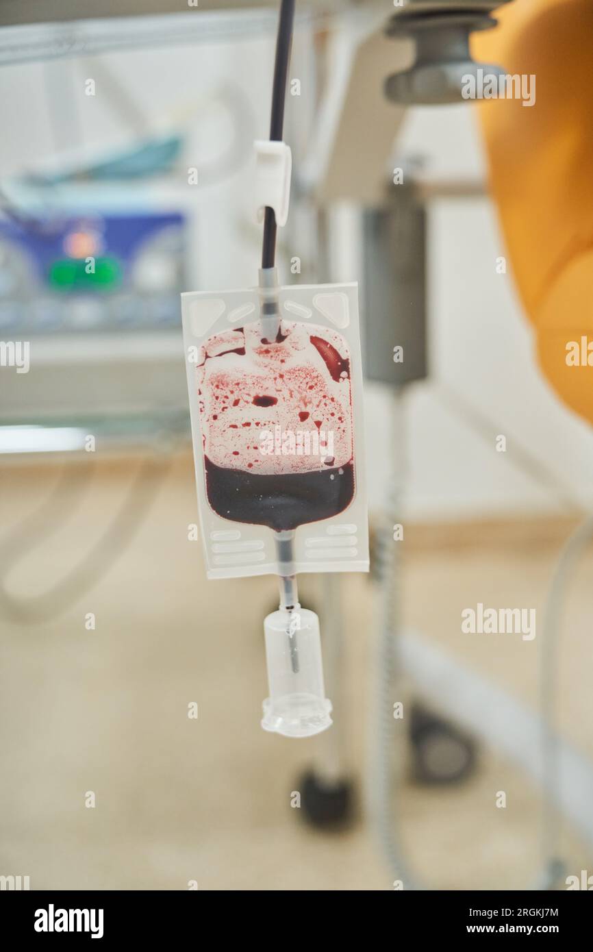 Plastic bag for blood collection placed near medical chair in lab with