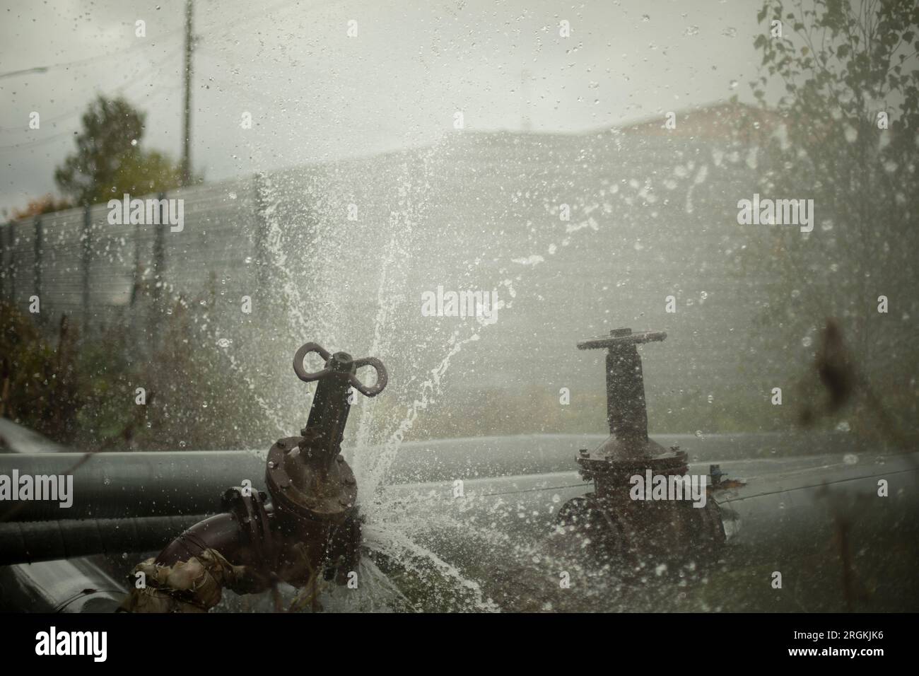 Pipeline burst. Water pours from pipes. Industrial disaster. Damage