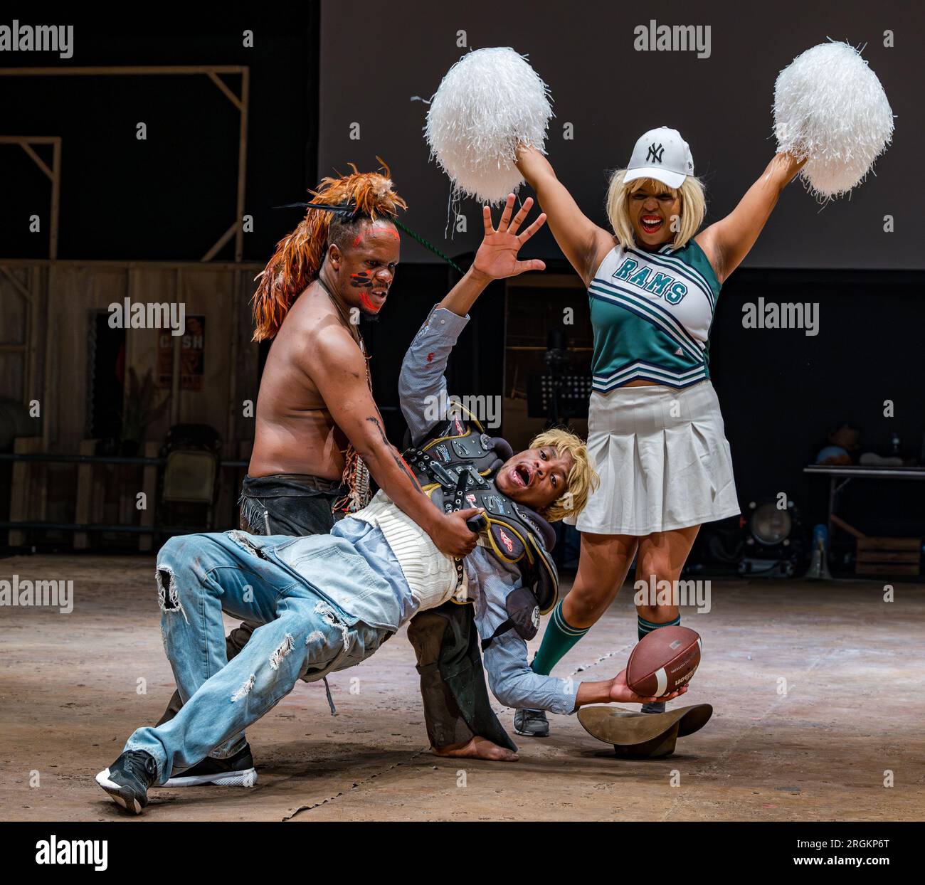 Edinburgh, Scotland, UK, 10 August 2023. Dark Noon at Edinburgh Festival Fringe: Dark Noon is a playful piece of theatre which tells the story of the Wild West. Actors portraying Cowboys and Native Americans perform in this American football scene from the show. Credit: Sally Anderson/Alamy Live News Stock Photo