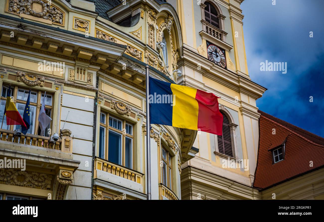 Sibiu, Romania - September 16 2022: Municipiului Sibiu or Sibiu City Hall with waving Romanian flag Stock Photo
