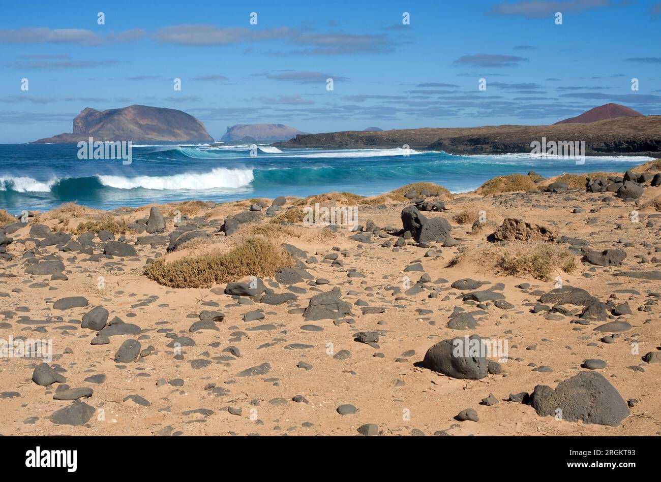 Montaña Clara (at left) and Alegranza Islands seen from Baja del Coral beach, La Graciosa Island. Las Palmas province, Canary Islands, Spain. Stock Photo