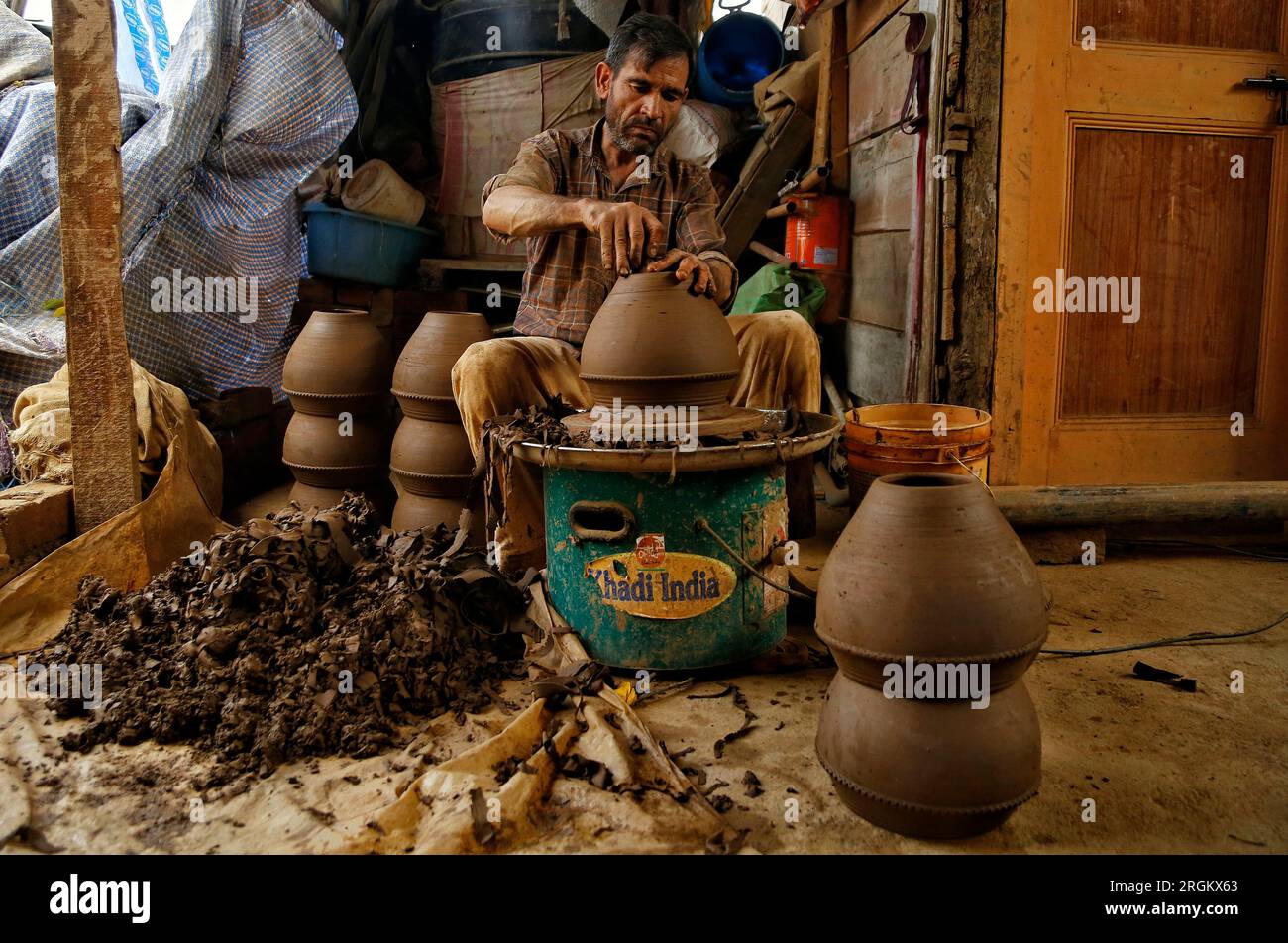 August 10,2023, Srinagar Kashmir, India Mohammad Yousuf Kumar, a Kashmiri potter works clay to