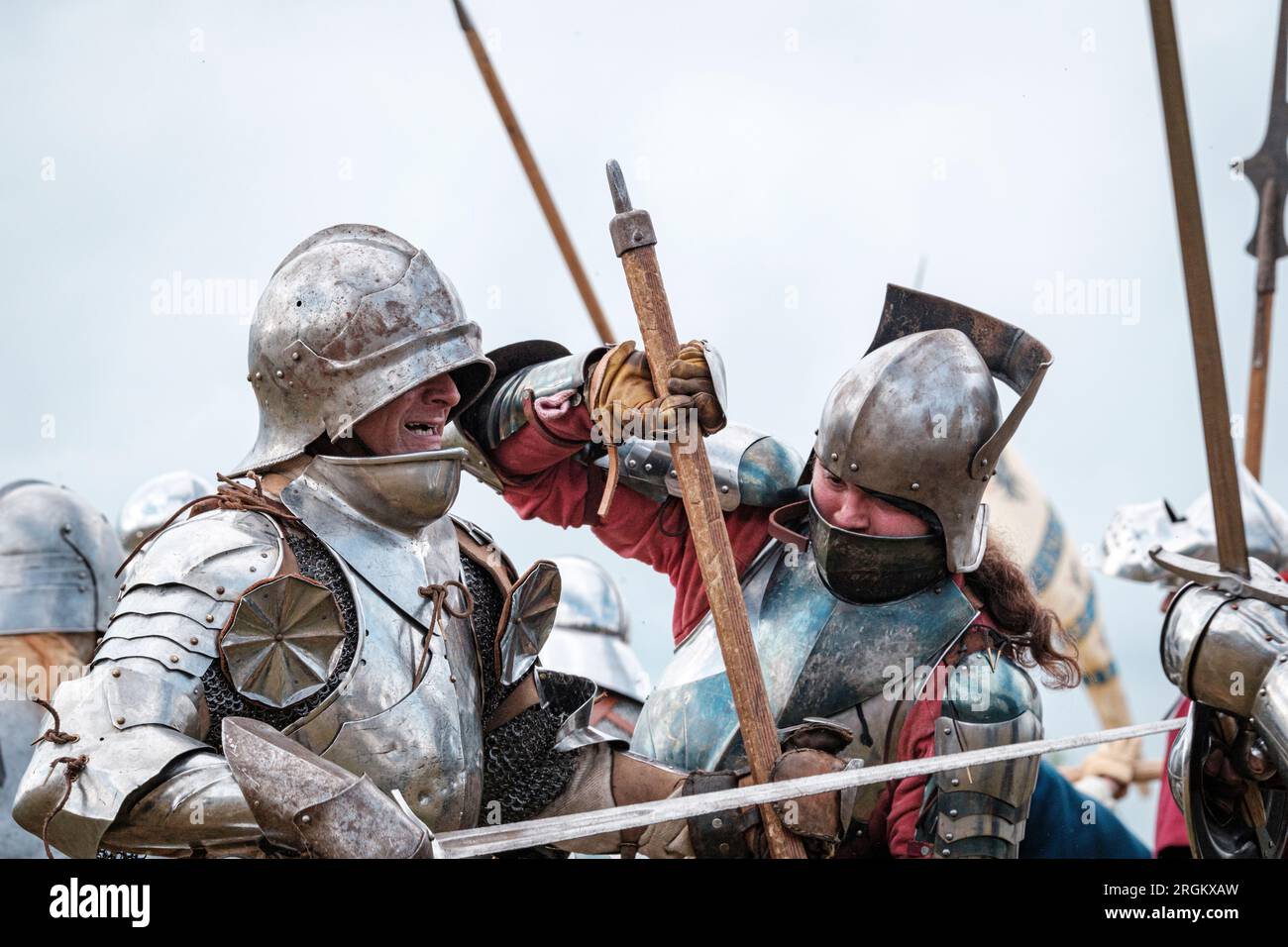 Re-enactors dressed in armour fight in the Battle of Tewkesbury (4 May 1471) re-enactment on the original battlefield in Tewkesbury Gloucestershire Stock Photo