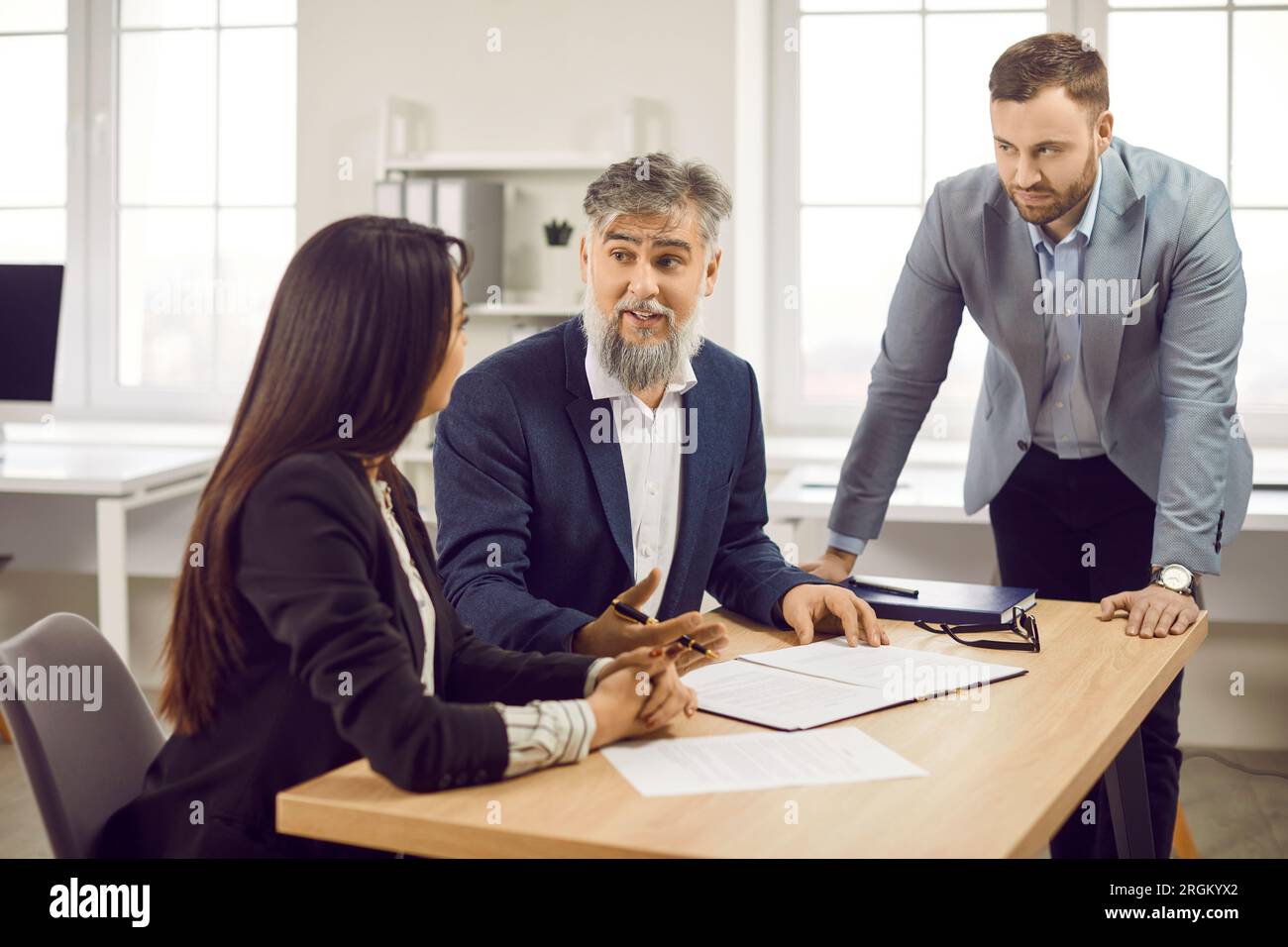 Corporate business people having a meeting in office, discussing new project or signing a contract Stock Photo