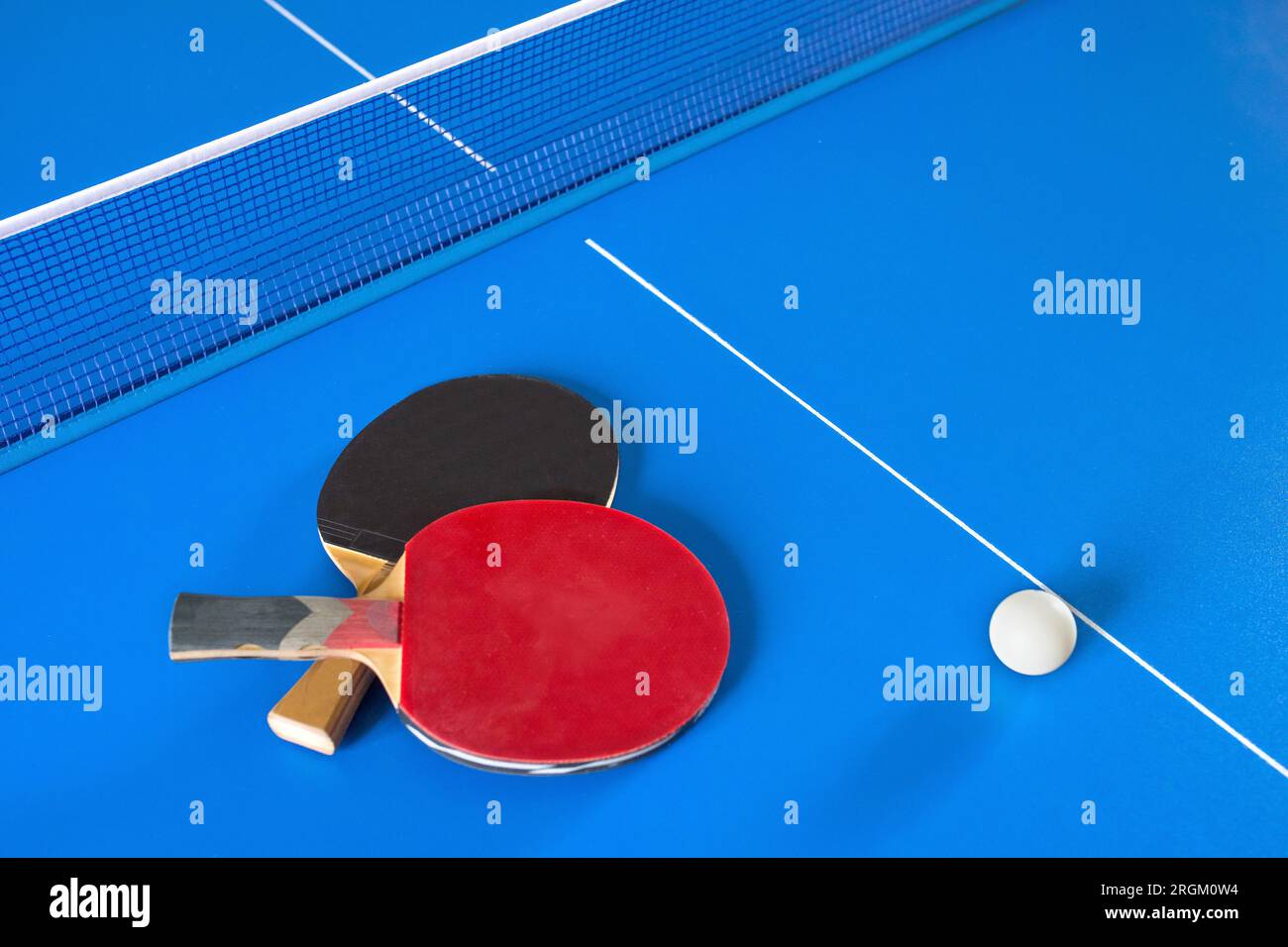 Table tennis rackets and ball on the table Stock Photo Alamy