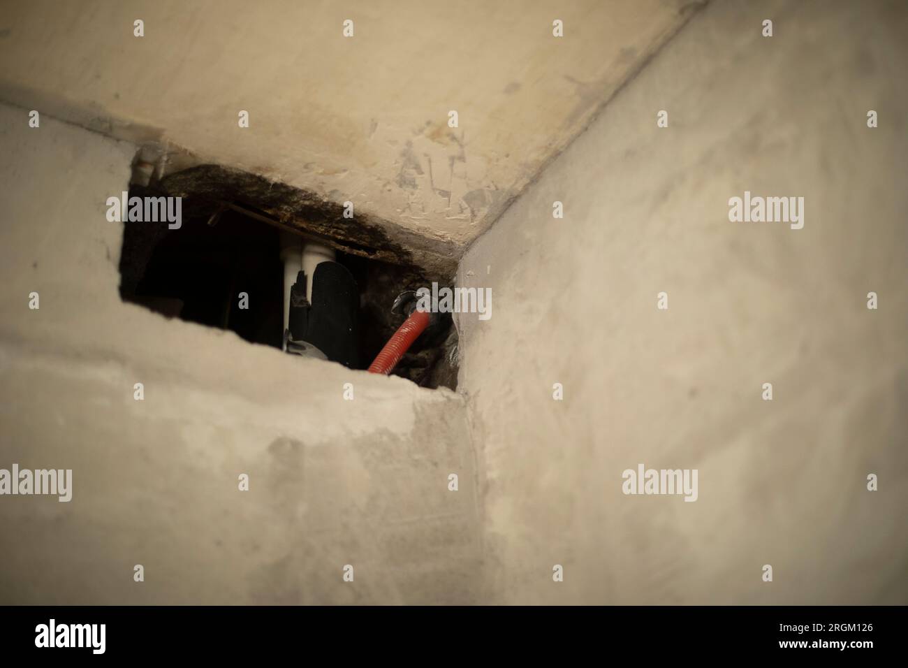 Hole in wall. Home repair. Concrete surface. Ventilation in apartment
