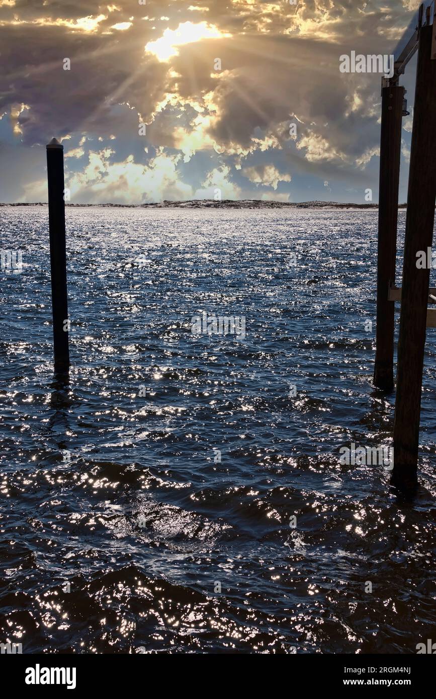 Sun beginning to set over the Gulf of Mexico in the panhandle of Destin, Florida. Stock Photo