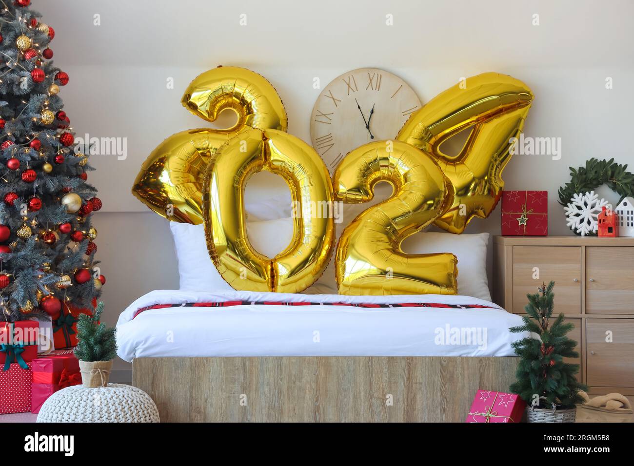 Balloons In Shape Of Figure 2024 On Comfortable Bed In Bedroom With   Balloons In Shape Of Figure 2024 On Comfortable Bed In Bedroom With Christmas Decor 2RGM5B8 