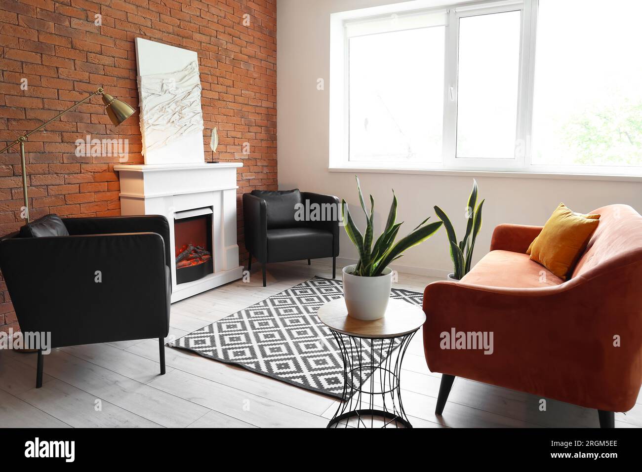 Interior of modern living room with stylish fireplace and sofa Stock ...